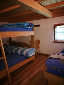 Postel nebo postele na pokoji v ubytování Rifugio Stella Alpina Spiz Piaz per escursionisti