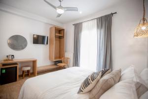 Postel nebo postele na pokoji v ubytování Oikia guesthouse