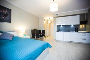 Postel nebo postele na pokoji v ubytování Apartamenty Feniks & Pegaz