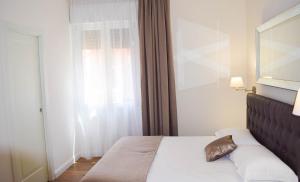 A bed or beds in a room at B&B La finestra sul canale