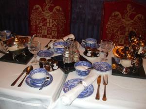 a table topped with blue and white dishes and silverware at The Lonsdale in Blackpool