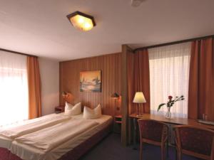 Postel nebo postele na pokoji v ubytování Hotel Köhler