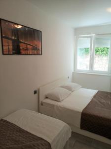 Posteľ alebo postele v izbe v ubytovaní APARTMENT SUNNY PARADISE, Center of Split