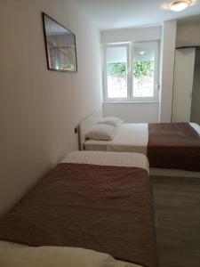 Posteľ alebo postele v izbe v ubytovaní APARTMENT SUNNY PARADISE, Center of Split