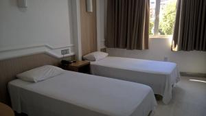 Ein Bett oder Betten in einem Zimmer der Unterkunft Hotel Rio Grande