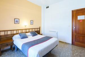 Postel nebo postele na pokoji v ubytování HOTEL RESTAURANTE MOYA