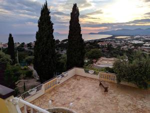 a balcony with trees and a view of a city at Hotel Belvedere in Sperlonga