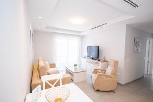 A television and/or entertainment centre at Cubo's Apartamento Tivoli B3