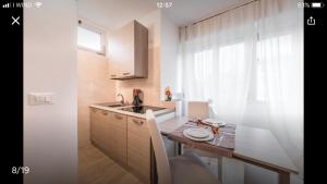 a small kitchen with a sink and a counter at Cervino in Favaro Veneto +4 photos