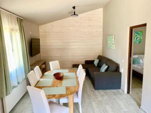 a living room with a table and a couch at Kalabash Apartments in Sovata