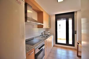 Kuchyňa alebo kuchynka v ubytovaní AL07 Apartamento a 300 metros de la playa de Fenals