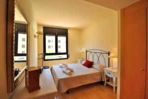 Posteľ alebo postele v izbe v ubytovaní AL07 Apartamento a 300 metros de la playa de Fenals