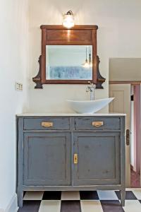 a white sink sitting under a mirror in a room at EL TORREON 109 CHARMING B&B - Recomendado Adultos in Frigiliana