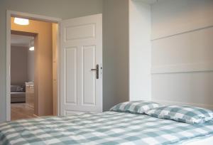 Łóżko lub łóżka w pokoju w obiekcie Apartament Terra Pia