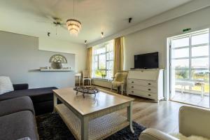 TV a/nebo společenská místnost v ubytování River Apartments