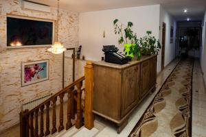 a room with a hallway with a staircase and a room with at Zajazd Orchidea in Nagoszewo