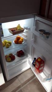 a refrigerator filled with lots of fresh fruits and vegetables at B&B RELAX in Messina