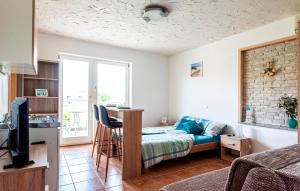 a bedroom with a bed and a tv in a room at Lavanda Apartments&Studios in Pinezici +86 photos