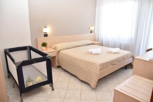 Postel nebo postele na pokoji v ubytování Hotel Excelsior