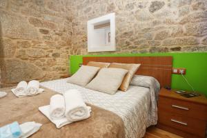 מיטה או מיטות בחדר ב-A Casa do Avó