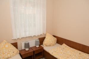 Postel nebo postele na pokoji v ubytování Apartamenty Fala