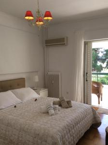 Posteľ alebo postele v izbe v ubytovaní aris sweet home 2