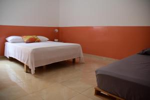 Letto o letti in una camera di Meeting Point- Tarrafal Center, also in Praia & Fogo-NO CASH ACCEPTED
