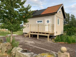 a tiny house is sitting on a lot at Station Bed and Kitchen Guesthouse in Varberg