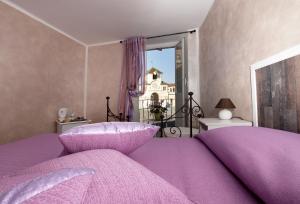 Postel nebo postele na pokoji v ubytování La Finestra Sulla Reggia