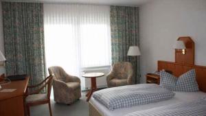 Postel nebo postele na pokoji v ubytování Hotel Herbstein