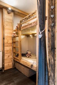 Giường trong phòng chung tại Aux pieds des cimes