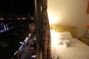 Postel nebo postele na pokoji v ubytování Plaza Mayor Hotel