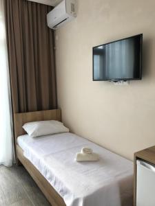Letto o letti in una camera di Hotel CHARLI