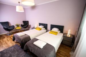 Posteľ alebo postele v izbe v ubytovaní erApartments Oxygen Residence