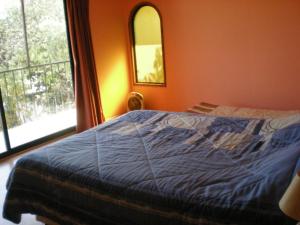 Postel nebo postele na pokoji v ubytování La Gran Casona de Olmue