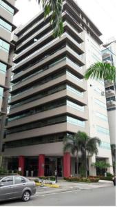a car parked in front of a large building at Suite amoblada súper cómoda in Guayaquil