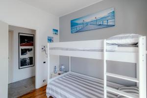 a bedroom with two bunk beds in a room at Villa Fantastica in Carate Urio