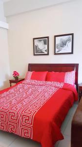 A bed or beds in a room at PICO DE LORO RESORT CONDOTEL