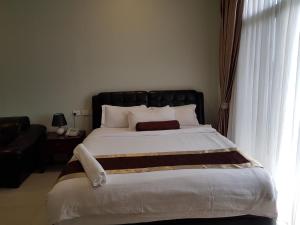 Postel nebo postele na pokoji v ubytování Lae City Hotel + 21 fotografií