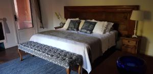 Postel nebo postele na pokoji v ubytování Tres Fuentes Hotel Boutique