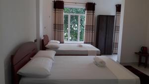 Giường trong phòng chung tại Risenlak Holiday Resort