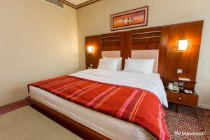 Postel nebo postele na pokoji v ubytování Grand Central Hotel