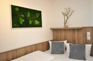 Postel nebo postele na pokoji v ubytování Hotel Perlach Allee by Blattl