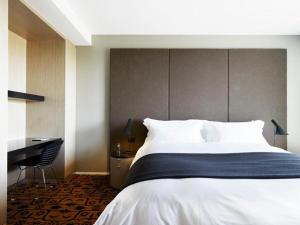 Postel nebo postele na pokoji v ubytování Burbury Hotel