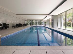 a swimming pool in the middle of a building at Gloria Residence in Taipei