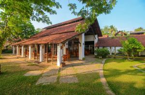 an image of a house with a roof at Punnamada Resort in Alleppey