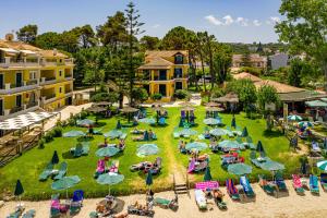 an aerial view of a park with chairs and umbrellas at Zarkadis Beach Apartments in Tsilivi