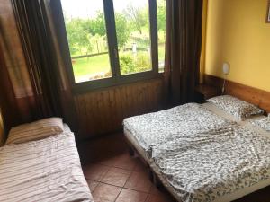 A bed or beds in a room at Agriturismo La Betulla
