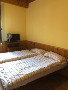 A bed or beds in a room at Agriturismo La Betulla