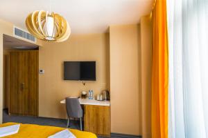 TV a/nebo společenská místnost v ubytování Hotel London